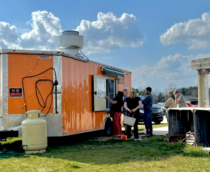 In line outside the order window of the food trailer