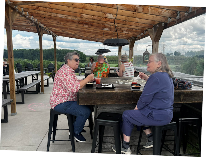 Enjoying Indian food on the covered patio of Townline Ciderworks